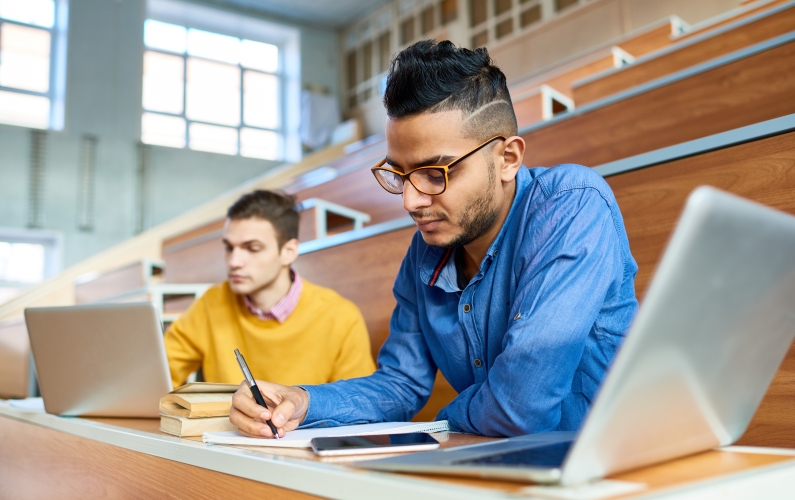 A photograph of students learning in the classroom