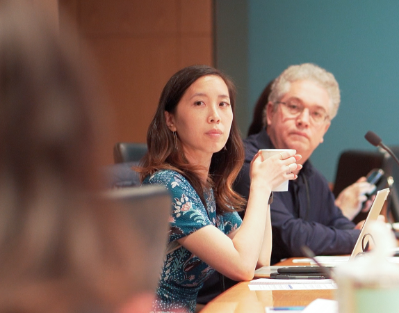 two members of creative community sitting at table